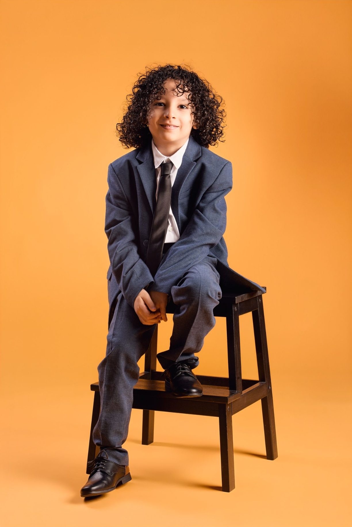 Formal suit on stool